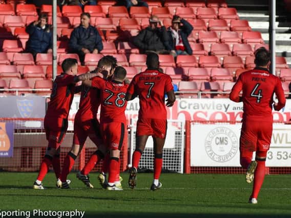 Crawley Town players celebrate James Collins' opening goal. Picture by PWW Sporting Photography