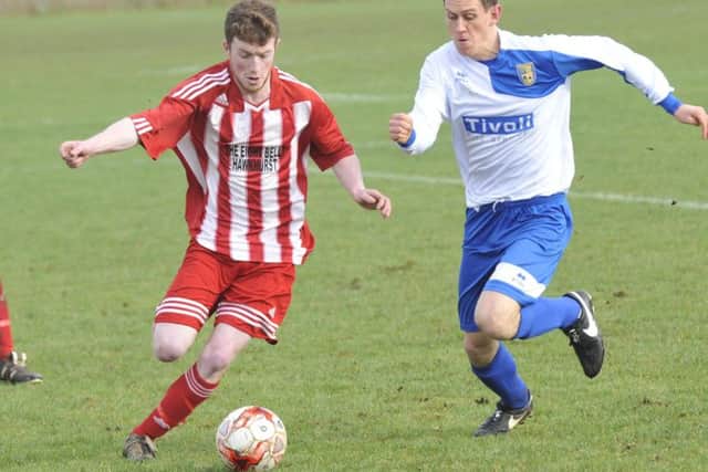 Sedlescombe and Hawkhurst tussle for possession at Oaklands Park on Saturday.
