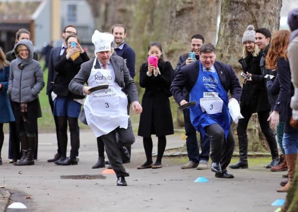 MP Tim Loughton at the 2016 Rehab Parliamentary Pancake Race. Photo: Oliver Dixon.