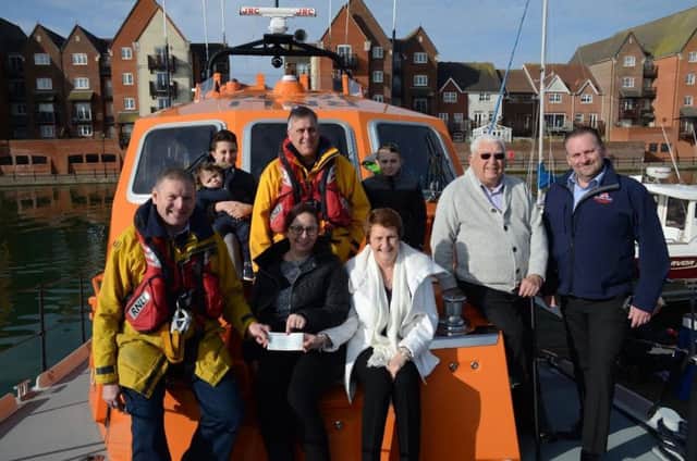 Dedicated fundraisers hand over the cheque to members of Eastbourne RNLI SUS-170602-170152001