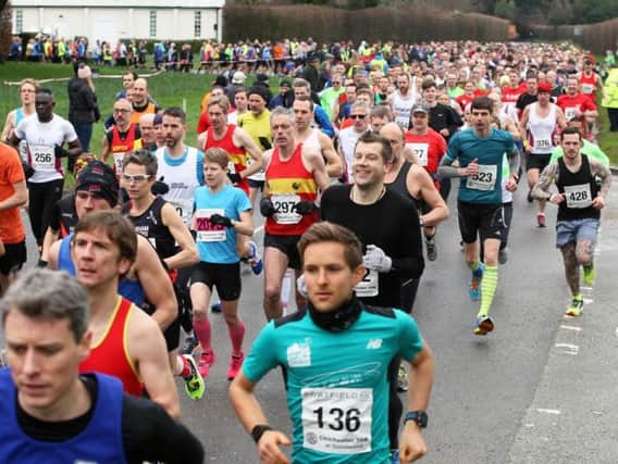 Racers begin their assault on the Chichester Priory 10k, which started                                                                            and finished at Goodwood motor circuit for the first time on Sunday. Picture: Derek Martin DM1724869