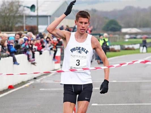 Finny McNally breaks the tape at the Chichester 10k on Sunday. Picture: Derek Martin DM1725131