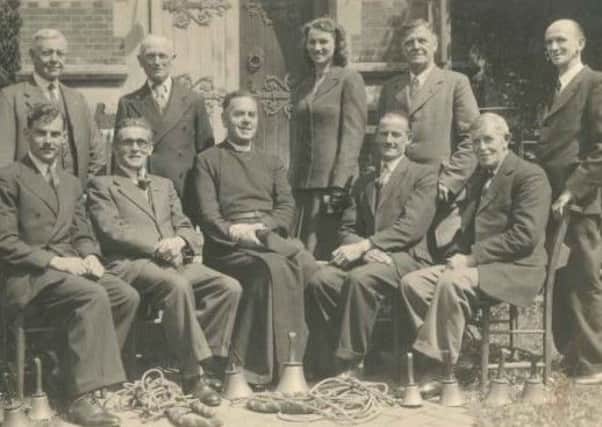 The couple are seeking the identities of the pictured group of bellringers