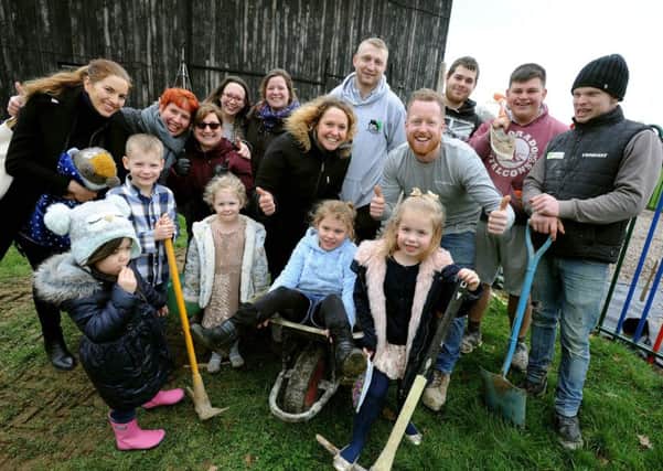 Holly Armstrong (middle), owner of the pre-school next to Ross Conquest and his work colleagues. Picture: Steve Robards