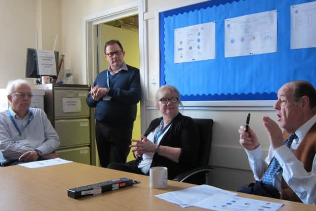 Sir Nicholas Soames chatting to some of the team at the advice centre last Friday (February 17). Picture: Citizens Advice