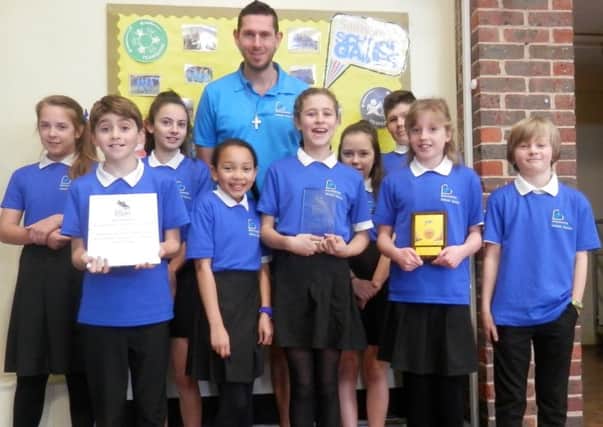 Mr Lund (PE and port teacher) with Year 6 sports leaders and their awards at Broadwater CE Primary School.