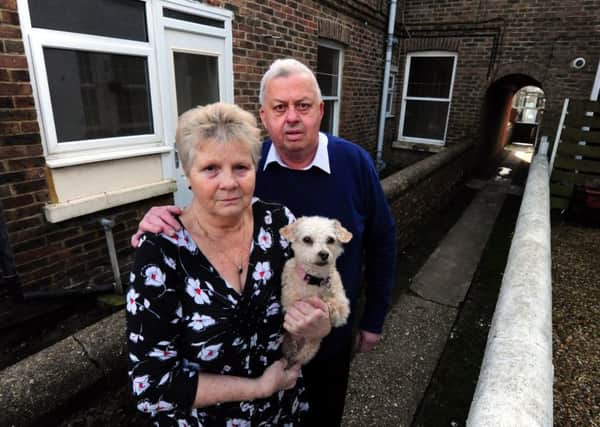 Roger and Janice Bullen on the path outside their house