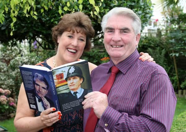 Tony and Lizzie Gilks with his book about his career in the Sussex Police DM155399a