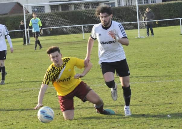 Matt Cunnington on the charge during the Boxing Day derby against Little Common. Picture by Simon Newstead