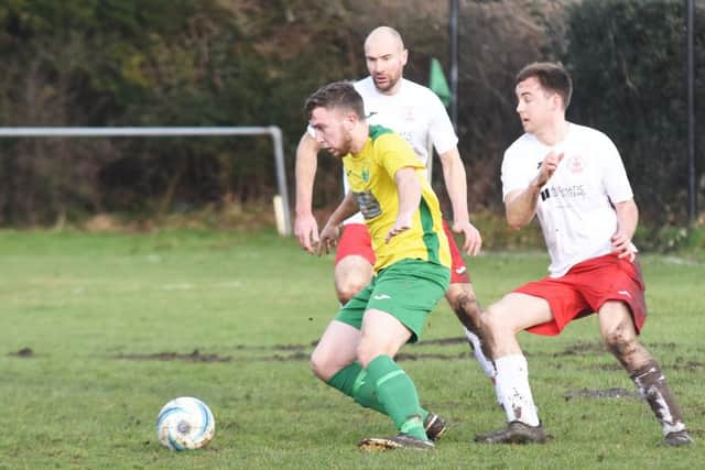 Charlie Cornford seeks to get away from the Bosham defence. Picture courtesy Jon Smalldon