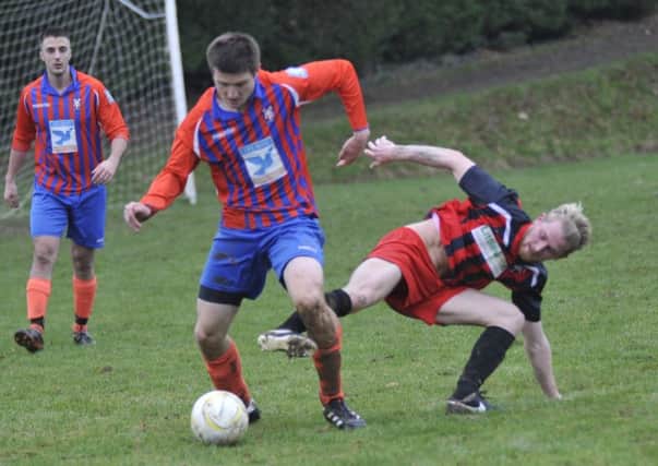 Action from Battle Baptists' last home game against Hollington United on January 7. Picture by Simon Newstead