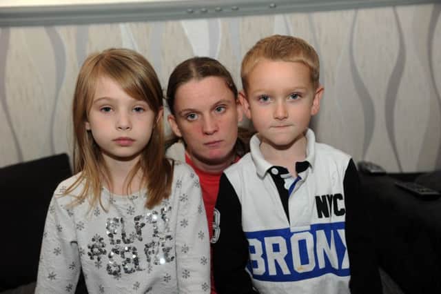 "Theres a rat in the kitchen what am I gonna do" - Rachael Hudson with her children Courtney 9 and James 5 at their home in Hampden Park which has a rat infestation (Photo by Jon Rigby) SUS-170602-140847008