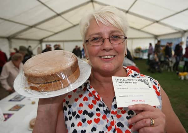 The Littlehampton Town Show and Family Fun Day needs you! Pictured is Sarah Oliver at last year's event with her first prize-winning Victoria sandwich. Picture: Derek Martin