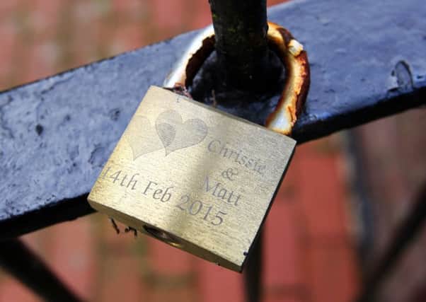 This love lock, beside Arundel bridge, has caused some debate. Photo by Derek Martin DM1725270a
