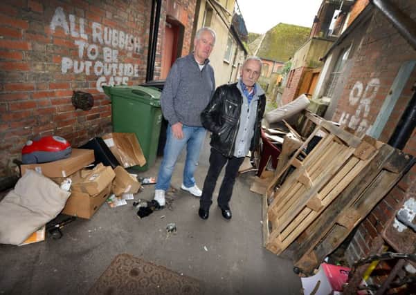 Fly tipping down alleyway off Western Road, Bexhill.

L-R Keith Hillman and Michael Noonan. SUS-170215-135042001