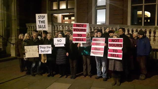 Protesters gathered outside Eastbourne Town Hall this week to oppose the sale of the farms