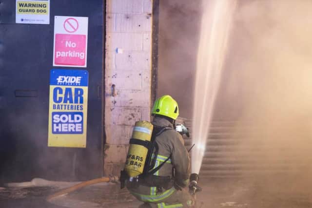 Fire crews used water jets to extinguish the fire. Photo by Eddie Mitchell.