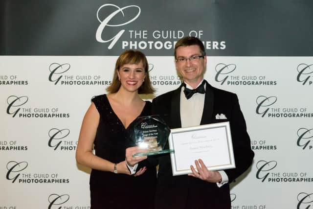 Simon and Abi Newbury, collecting Guild of Photographers award. Photo by Foster Photographers. SUS-170213-112444001