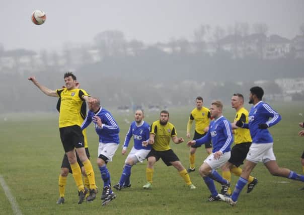 Old Hastonians defend a corner during their match against St Leonards Social. Picture by Simon Newstead