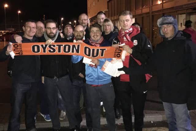 Crawley Town fans join the Oyston Out campaign at Blackpool. Picture by Steve Herbert SUS-170213-174955002