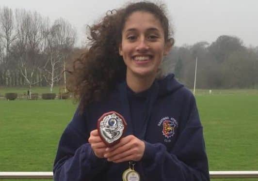 Maya Ramnarine, of Hastings Athletic Club, displays her prizes after winning the under-15 girls' age group in the Sussex Cross-Country League.