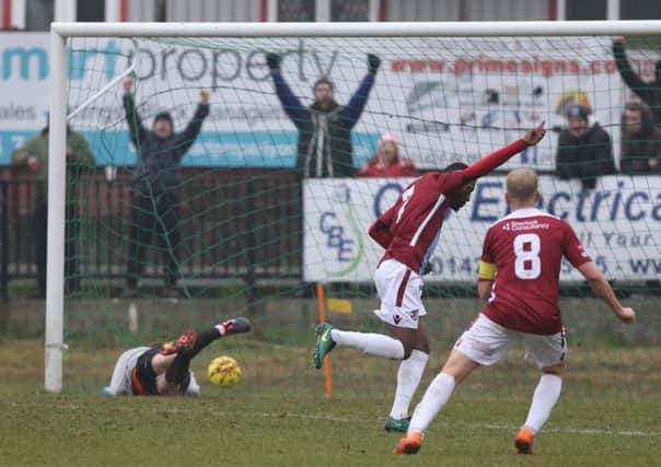 Kiernan Hughes-Mason raises his arm in celebration after scoring his second goal in Hastings United's 4-0 weekend win over Whyteleafe. Picture courtesy Scott White