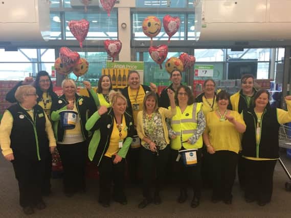 Staff at ASDA St Leonards on Sea raised funds for St Michael's  Hospice Yellow Week SUS-170214-105237001
