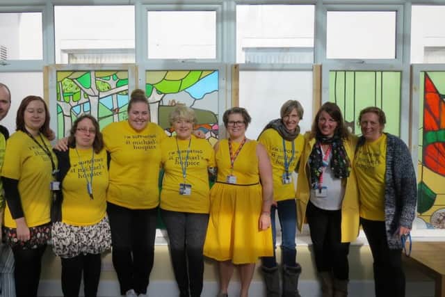 St Michael's Hospice fundraising team celebrate Yellow Week SUS-170214-105314001