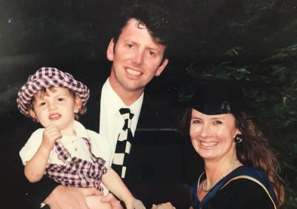 James as a toddler with Kim at Ruth's graduation