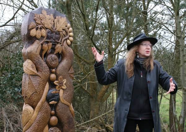 Sculptor Janine Creaye with the Binstead waymarker.