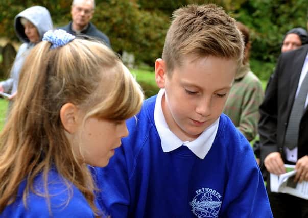 George Homewood and Annabel Strange from Petworth Primary School lay the wreath at last year's memorial service