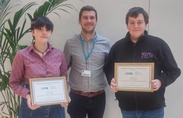 Ashley Chapman presents Huda and George with their certificates SUS-170214-114521001