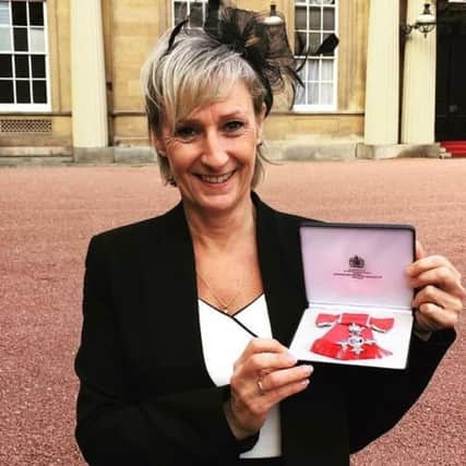 Tracy Barnett MBE receives her award at Buckingham Palace. SUS-170213-115713001
