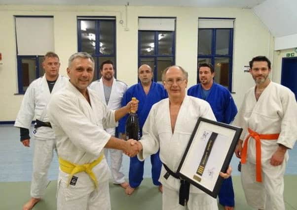 Derek Paxton (left) received an accolade for his service to judo
