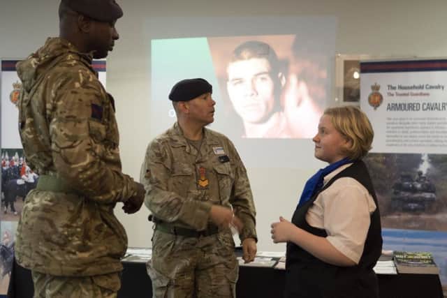 Year 10 Hospitality student Charlottte Dudman, welcoming exhibitors from the British Army.