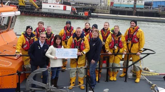 Cheque presentation. Photo courtesty of Newhaven Lifeboat. SUS-170216-153918001