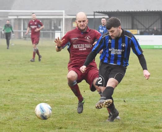 Little Common player-manager Russell Eldridge closes down a Langney Wanderers opponent last weekend. Picture courtesy Jon Smalldon
