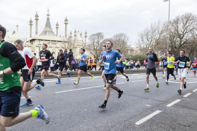 Runners pass the Royal Pavilion (Photograph: Will Corder) SUS-170214-110706001