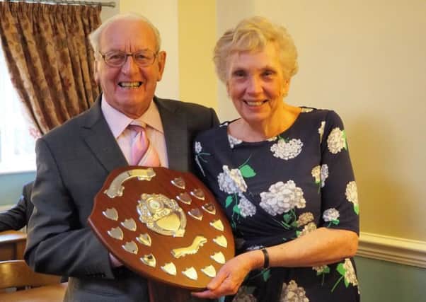Carol Sands receives Nyetimber's champion's shield from Arthur Guppy
