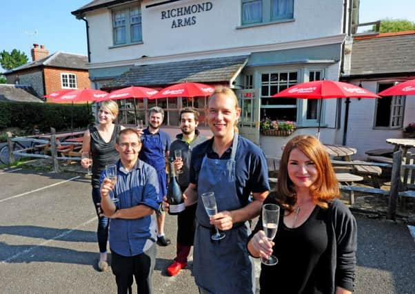 Happier times. William and Emma Jack and the team celebrating the Richmond Arms being voted 29th best pub in the country by a Good Food Guide in 2014.  Picture by Kate Shemilt.C140858-3 SUS-140309-104433001