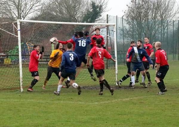 Action from the Angmering-Pirates game / Picture by Roger Smith