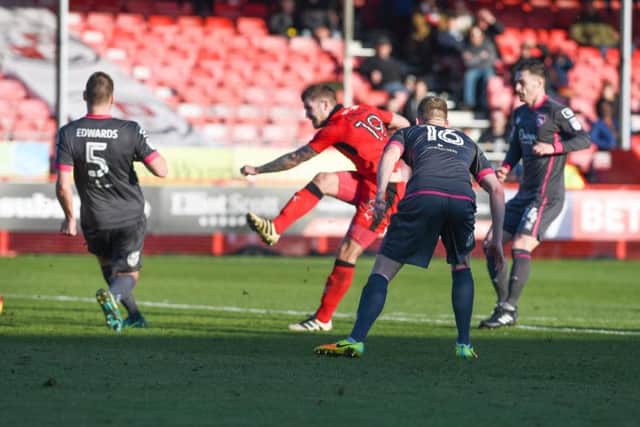Crawley Town striker James Collins takes a shot against Morecambe.
Picture by PW Sporting Photography.