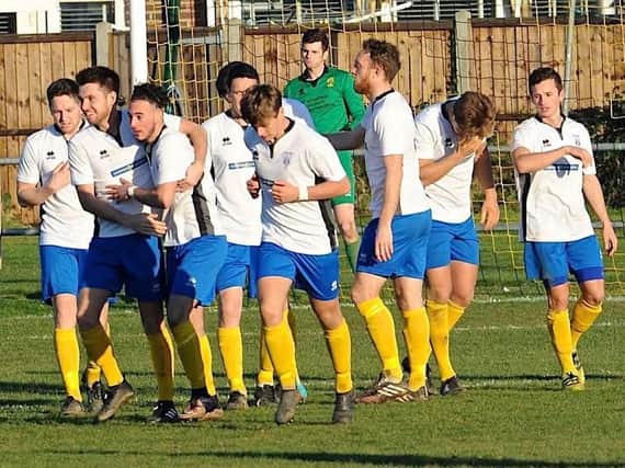Lancing players celebrate their second goal at Littlehampton on Saturday. Picture: Stephen Goodger