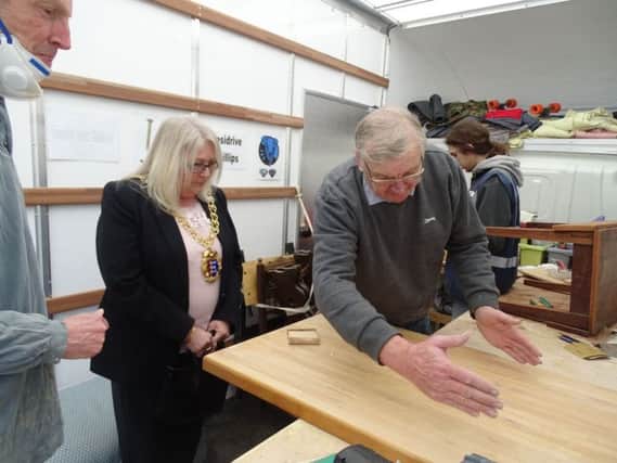 Hastings Mayor Cllr Judy Rogers is shown some DIY skills by  workshop tutor Ron Hall SUS-170221-112337001