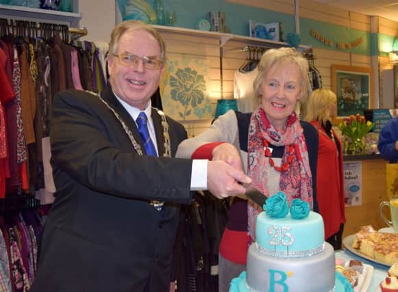 Arun District Council chairman Stephen Haymes and volunteer Maureen Parker cut the cake