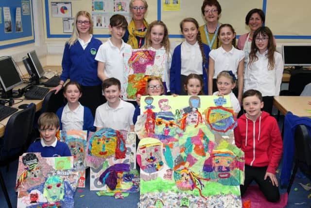 Artist Nadia Chalk, back right, and the children with Steyning Decorative and Fine Arts Society chairman Ann Blakelock and Young Art co-ordinator Pam Childs. Picture Derek Martin DM17210286a