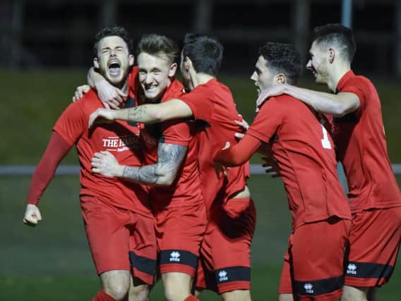 Michael Death celebrates his goal with team mates. Picture by PW Sporting Photography
