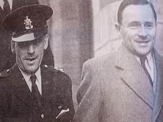 Haigh being led from Horsham town hall in 1949