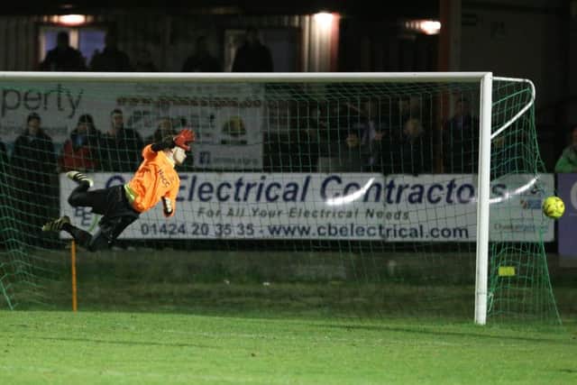 The Carshalton goalkeeper is beaten for the fifth Hastings United goal. Picture courtesy Scott White
