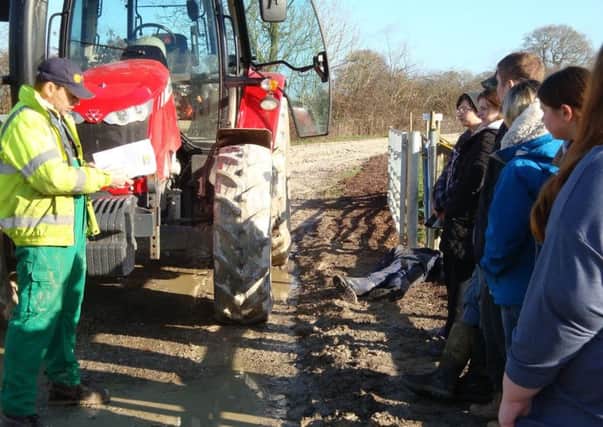 The students learn about the dangers of farming